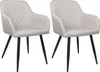 Two beige upholstered dining chairs with black legs are shown against a white background.