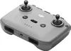 A close-up, angled view of a gray DJI drone remote control. Podgląd zdjęcia produktu