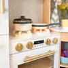 A close-up view of a toy kitchen stove with pots and pans on top and an oven door below. Podgląd zdjęcia produktu