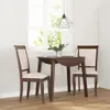 A dining set with two chairs and a table in a room with a window and blinds. Produktbild-Vorschau