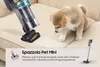 A puppy on a couch with a vacuum cleaner. Produktbild-Vorschau