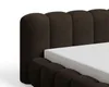 Close-up of a brown upholstered bed frame with a white mattress. Voir les images du produit