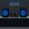 A MEDION P85003 micro audio system with two speakers, presented against a dark background with blue light effects emanating from the speakers. Produktbild-Vorschau