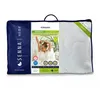 A pillow in its packaging, featuring a woman stretching in bed. Podgląd zdjęcia produktu