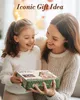 A mother and daughter are smiling and holding a gift box. Produktbild-Vorschau
