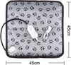A square pet heating pad with a paw print pattern, a power cord, and a control unit. Produktbild-Vorschau