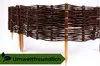 A close-up shot of a woven willow garden border fence with wooden stakes, set against a white background. A green banner with leaves and the text "Umweltfreundlich" is overlaid at the bottom. Produktbild-Vorschau