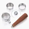 A set of espresso machine accessories laid out on a white background. Náhled obrázku produktu