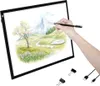 A hand is using a stylus to draw on a light pad displaying a landscape. Produktbild-Vorschau