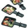 Three raclette pans filled with food, arranged diagonally. Produktbild-Vorschau