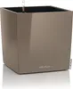 A square, high-gloss taupe planter with a water level indicator visible inside. Náhled obrázku produktu