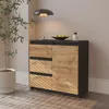 A sideboard with drawers and a door, placed in a room with a plant and a lamp. Produktbild-Vorschau