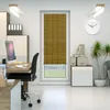An office setting with a desk, computer, chair, and a window with a bamboo blind. Produktbild-Vorschau