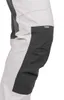 A close-up view of the side of a pair of pants, showing the knee area with a darker fabric panel. Produktbild-Vorschau