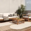An outdoor patio setting with modern furniture and plants. Produktbild-Vorschau