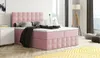 A pink upholstered bed with a headboard and pillows in a bedroom setting. Produktbild-Vorschau