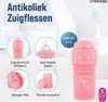 A pink Twistshake baby bottle with various accessories and feature callouts. Podgląd zdjęcia produktu