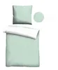A flat lay of a duvet cover and pillowcase set with a subtle dot pattern. Produktbild-Vorschau
