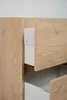 Close-up view of a wooden cabinet with two open drawers. Podgląd zdjęcia produktu
