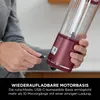 A person is plugging a USB-C cable into the base of a portable blender. Podgląd zdjęcia produktu