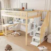 A bedroom scene featuring a loft bed with a desk and storage stairs. Náhled obrázku produktu
