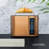 A copper-colored toaster with a croissant on top, set against a textured gray background and a black surface with a cloth. Náhľad obrázku produktu