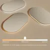 Three oval mirrors with LED lighting are shown on a light beige background, with a color temperature slider below. Podgląd zdjęcia produktu