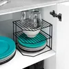 A black metal corner shelf holding kitchenware inside a cabinet. Náhled obrázku produktu