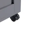A close-up view of the bottom corner of a gray cabinet with a black caster wheel. Produktbild-Vorschau