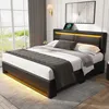 A modern bedroom with a black upholstered bed frame featuring LED lighting and a headboard with a charging station. Náhľad obrázku produktu