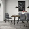 A dining room scene with a table and chairs. Produktbild-Vorschau