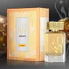 A perfume bottle and its box are displayed on a reflective surface with a blurred background. Anteprima dell’immagine prodotto