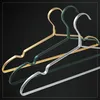 Three metal hangers are displayed against a black background. The hangers are layered, with a gold hanger at the back, a green hanger in the middle, and a silver hanger in the front. Each hanger has a curved hook and a wide, flat shoulder section with a sl Produktbild-Vorschau