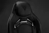 Close-up of the headrest and upper back of a black gaming chair. Náhled obrázku produktu