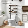 A bathroom shelf unit is shown above a toilet, with decorative elements and product feature callouts. Náhled obrázku produktu