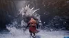A video game scene depicting a battle between a large, furry monster and a human character in a snowy environment. Produktbild-Vorschau