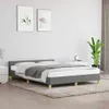 A bedroom scene with a bed, nightstand, and plant. Podgląd zdjęcia produktu