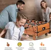 A family is playing foosball together. Produktbild-Vorschau