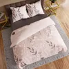 A top-down view of a bed with a duvet cover and pillows. Produktbild-Vorschau