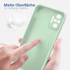 A hand touching a light green phone case, with fluffy white material in the background. Produktbild-Vorschau
