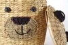 A close-up view of a woven basket designed to look like a bear's face, with its lid partially open. Produktbild-Vorschau