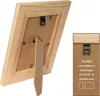 The back of a wooden picture frame with a stand and hanging mechanism is shown, with a close-up inset of the hanging mechanism and text. Produktbild-Vorschau