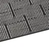 A close-up, angled view of a textured mat with a black and gray pattern. Podgląd zdjęcia produktu