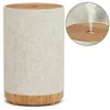 A humidifier diffuser with a fabric exterior and wood-grain base and top. Produktbild-Vorschau