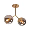 A two-light ceiling lamp with gold metal accents and smoked glass globes. Produktbild-Vorschau