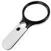 A close-up studio shot of a black and white LED-illuminated magnifying glass against a white background. Náhled obrázku produktu
