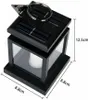 A black solar-powered lantern with glass panels, showing dimensions. Voir les images du produit