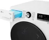Close-up of a white LG washing machine with the detergent drawer pulled out, showing blue detergent pods inside. The control panel with a digital display and a dial is visible. Produktbild-Vorschau