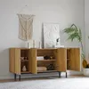 A wooden sideboard with open doors, displaying decorative items and books, in a well-lit room with a macrame wall hanging and a plant. Náhľad obrázku produktu