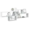 A white modular shelving unit is displayed against a white background, showcasing various decorative items and books. Náhled obrázku produktu